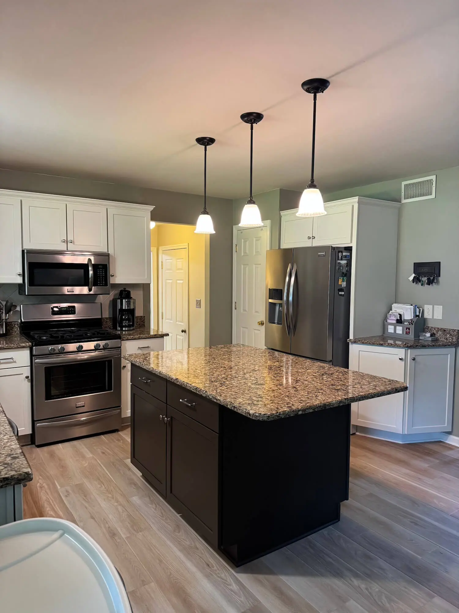 refaced cabinets in kitchen painted white in a lancaster home by martzalls