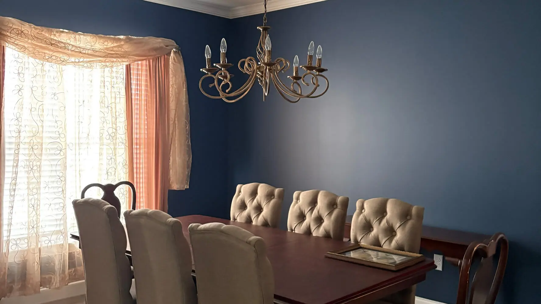 Freshly painted navy dining room completed by professional interior painters