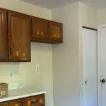 Dated golden oak kitchen cabinets before professional cabinet painting