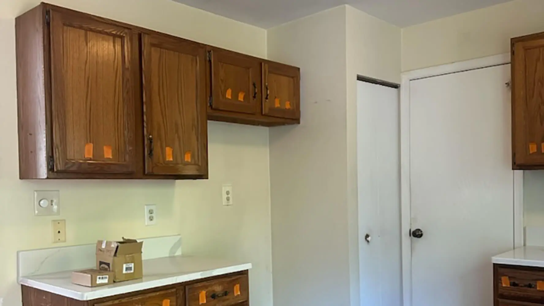 Dated golden oak kitchen cabinets before professional cabinet painting