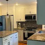 Professionally painted white kitchen cabinets after a cabinet painting project in Lancaster County