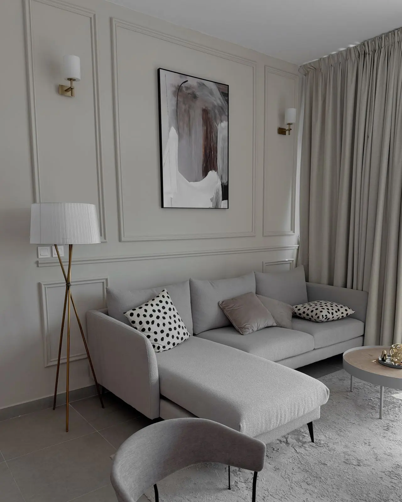 Greige living room walls with painted panel moulding completed by professional interior painters in Mohnton, PA