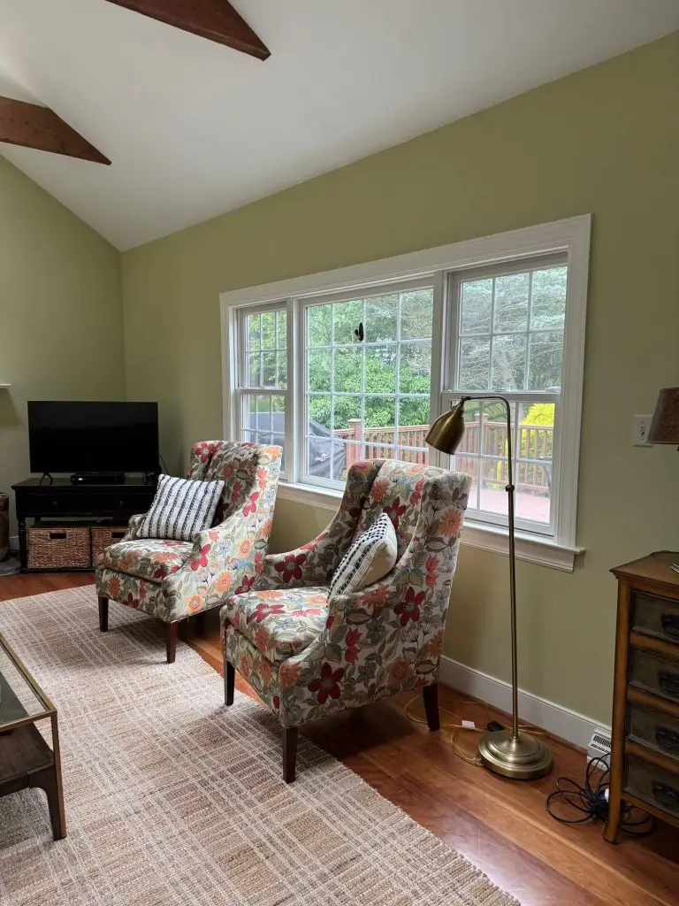 Interior painting in a bright, furnished living room with large windows completed by Martzall’s Custom Surfaces in Mohnton, PA.