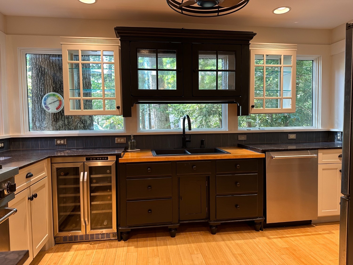 Modern kitchen remodel featuring black and white cabinets with butcher block countertops by Cabinet Refacing in Lancaster County, PA