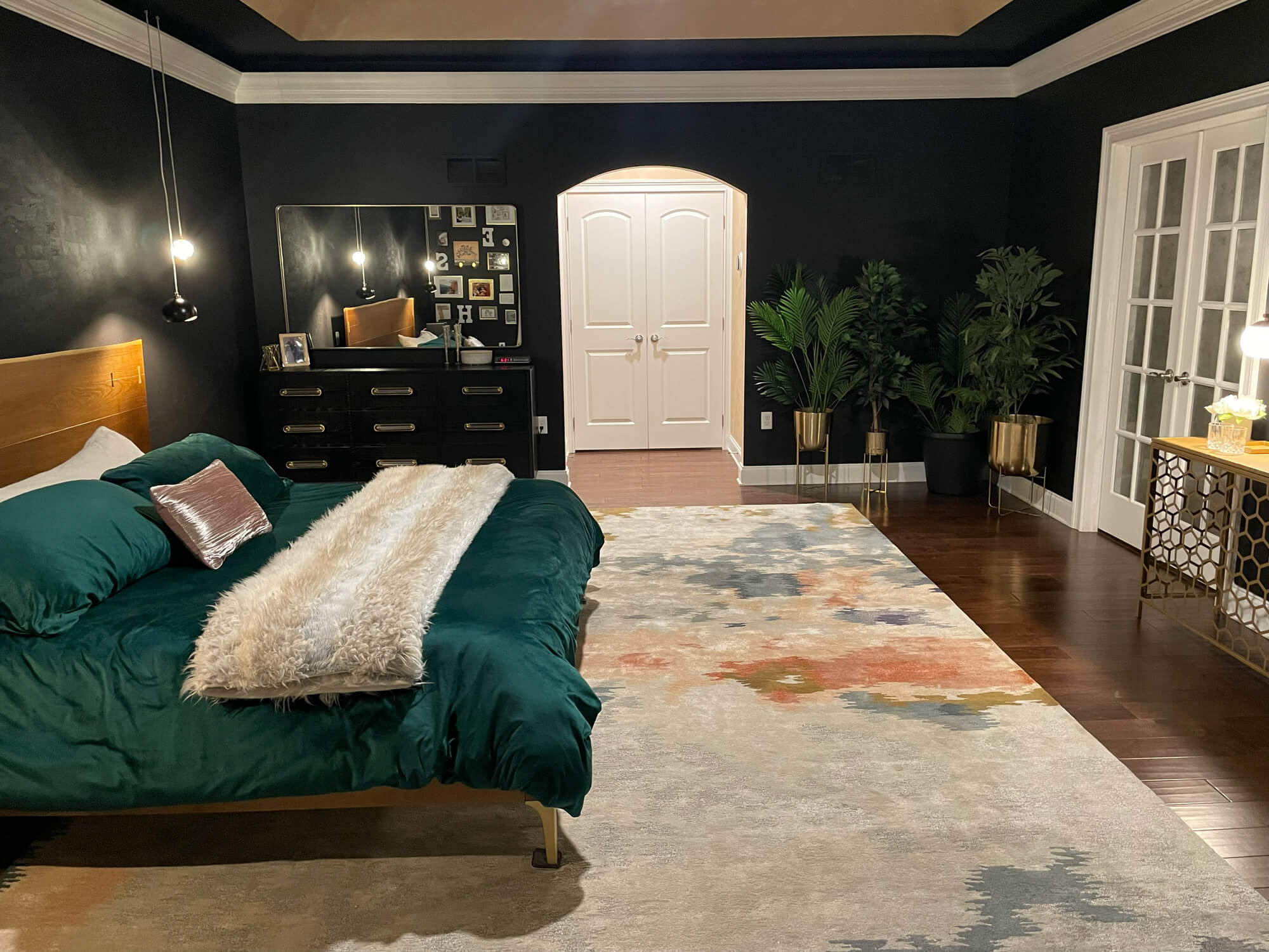 Modern bedroom with bold black walls and white trim painted by Martzall’s Custom Surfaces serving Lititz, PA and surrounding Lancaster County communities