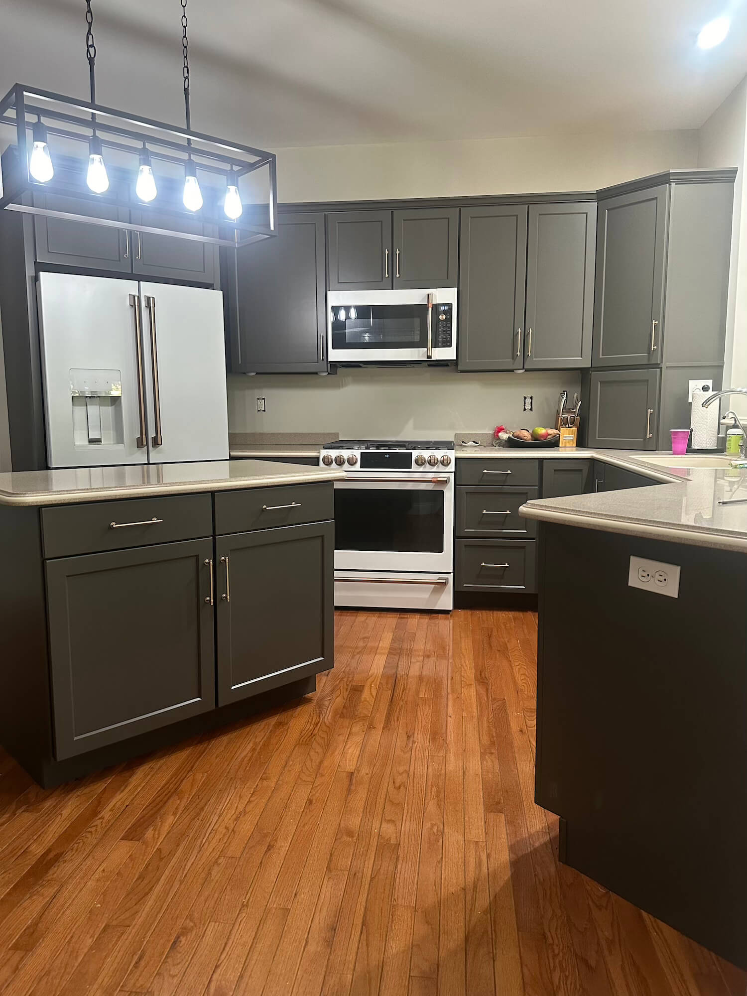 refaced cabinets in kitchen painted gray in a lancaster home by martzalls