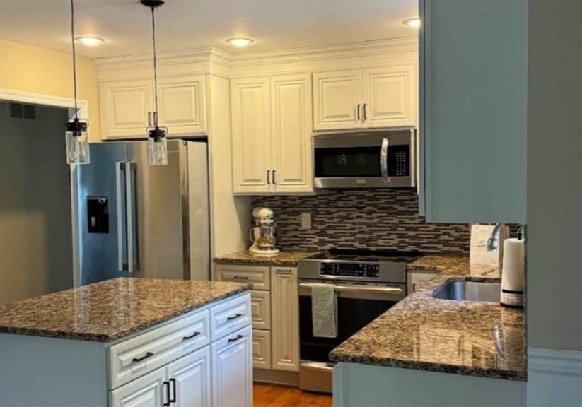 Professionally painted white kitchen cabinets after a cabinet painting project in Lancaster County
