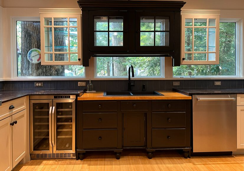 Two-tone kitchen cabinets with dark stained island and white upper cabinetry refinished by Martzall’s Custom Surfaces serving Lititz, PA and surrounding Lancaster County communities