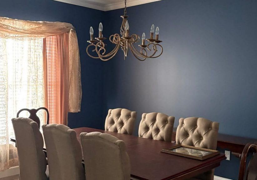 Freshly painted navy dining room completed by professional interior painters